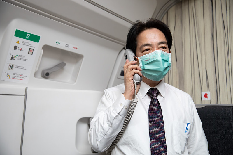 Vice President Lai delivers remarks over the charter plane's public address system.